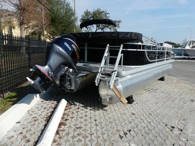 Slide: The Image of 2025 Godfrey Pontoons Xperience 2286 SBX with Yamaha outboard motor on display. - 4