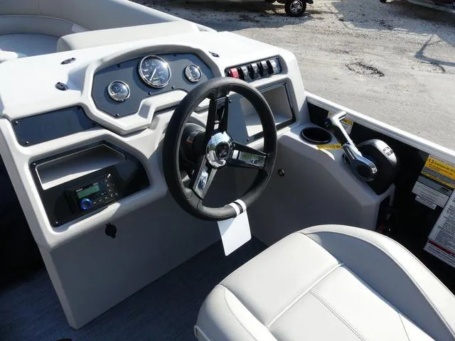 Slide: The Image of 2025 Godfrey Pontoons Xperience 2286 SBX dashboard with steering wheel and controls. - 8