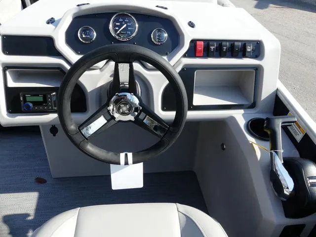 Slide: The Image of 2025 Godfrey Pontoons Xperience 2286 SBX dashboard with steering wheel and control panel. - 9