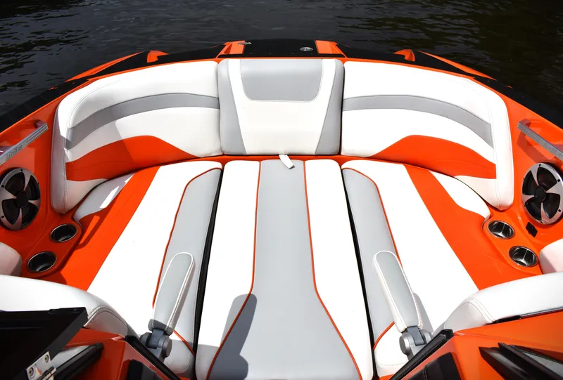 Slide: The Image of 2020 Malibu Wakesetter 22 MXZ interior with orange and white seating. - 25