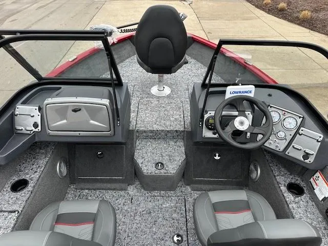 Slide: The Image of 2025 Tracker Pro Guide V-175 Combo boat interior with steering wheel and seating. - 4