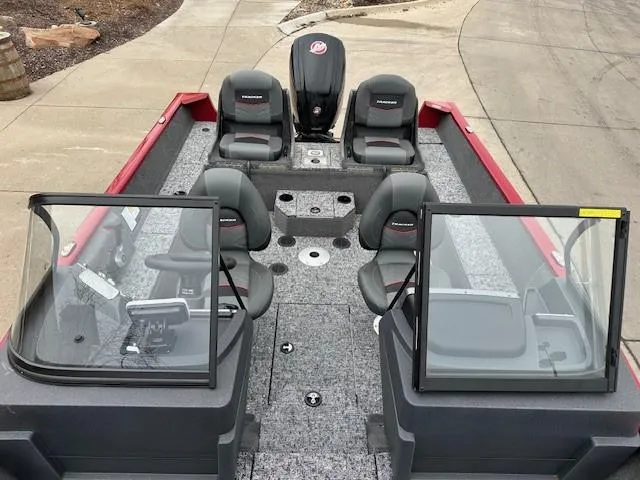 Slide: The Image of 2025 Tracker Pro Guide V-175 Combo boat interior with seating and console. - 6