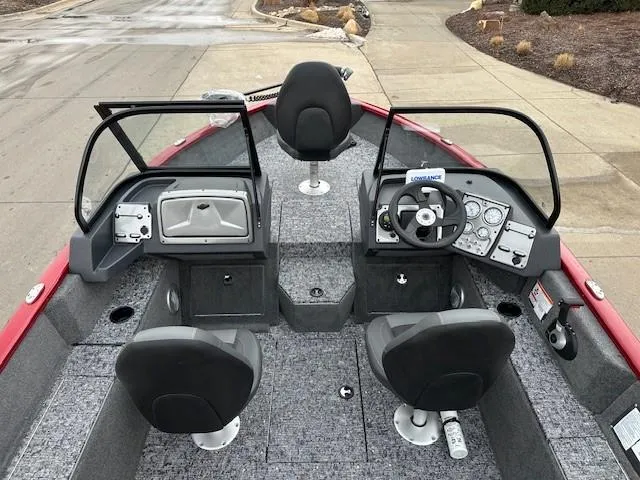 Slide: The Image of 2025 Tracker Pro Guide V-175 Combo boat interior with dual consoles and seating. - 7