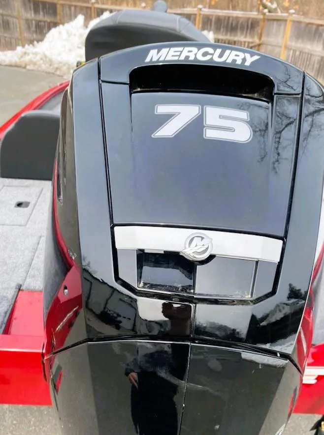 Slide: The Image of 2025 Tracker Pro Team 175 with Mercury 75 outboard motor, red and black design. - 3