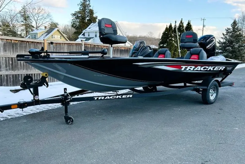 The Image of 2025 Tracker Pro Team 190 boat on trailer, parked outdoors. - 0