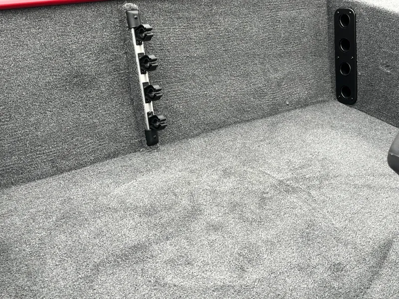 Slide: The Image of 2025 Tracker Bass Tracker Classic XL interior with rod holders and carpeted flooring. - 16