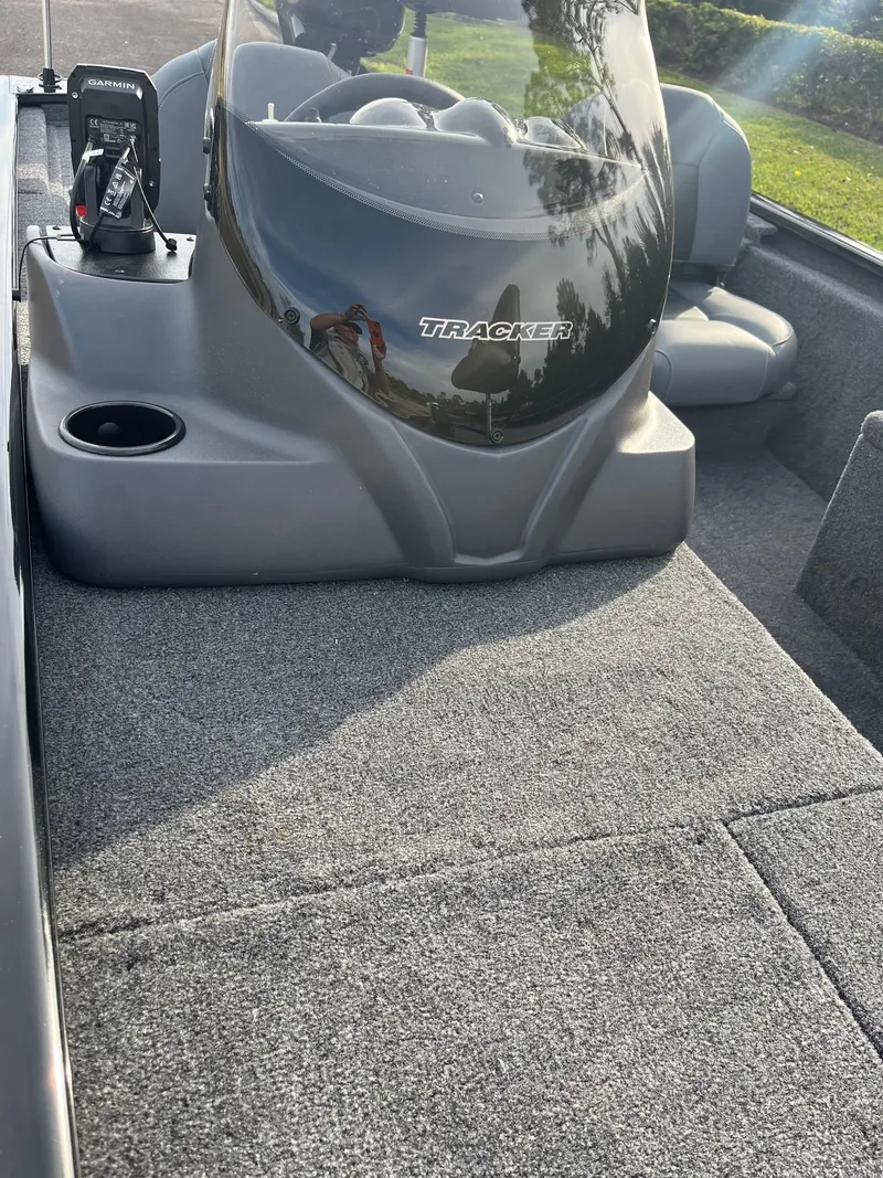 Slide: The Image of 2025 Tracker Pro 170 boat interior with gray carpet and seating. - 4