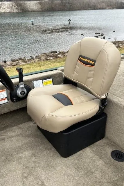 Slide: The Image of 2025 Tracker Bass Tracker Classic Limited boat seat by a lake. - 45