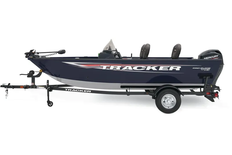Slide: The Image of 2025 Tracker Pro Guide V-16 SC boat with Mercury 60 engine in showroom. - 2