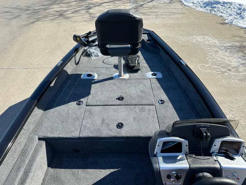 Slide: The Image of 2025 Tracker Pro Team 175 Crappie Edition boat interior with seating and control panel. - 4