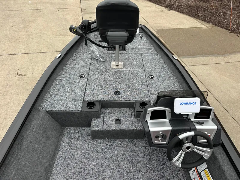 Slide: The Image of 2025 Tracker Pro Team 175 boat interior with steering wheel and Lowrance system. - 4