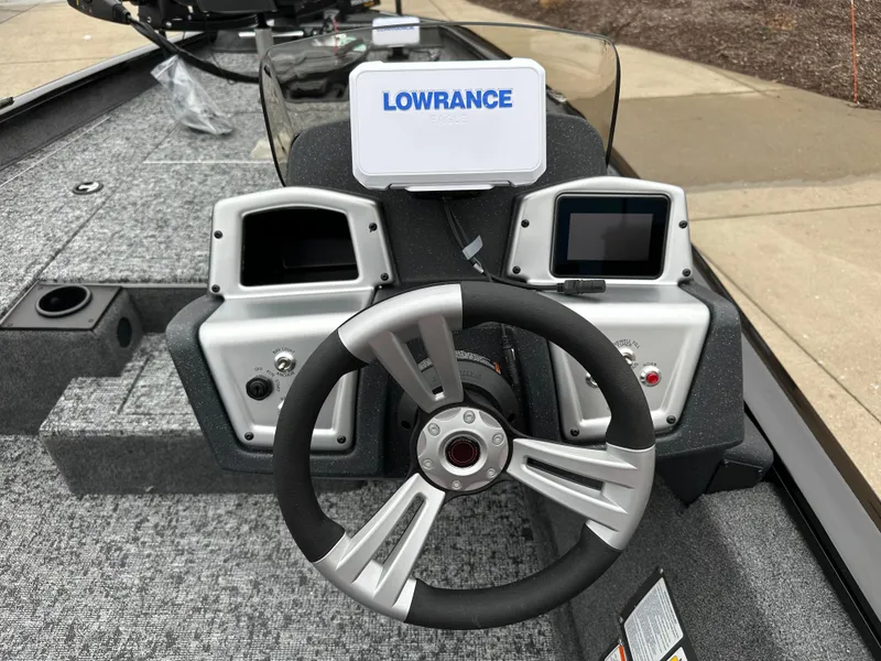 Slide: The Image of 2025 Tracker Pro Team 175 boat dashboard with Lowrance electronics and steering wheel. - 5