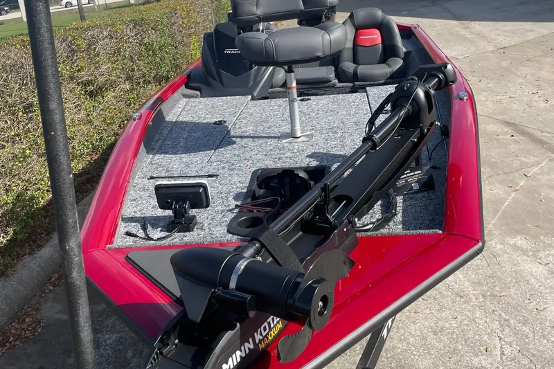Slide: The Image of 2025 Tracker Pro Team 190 boat with red exterior and advanced fishing equipment. - 3