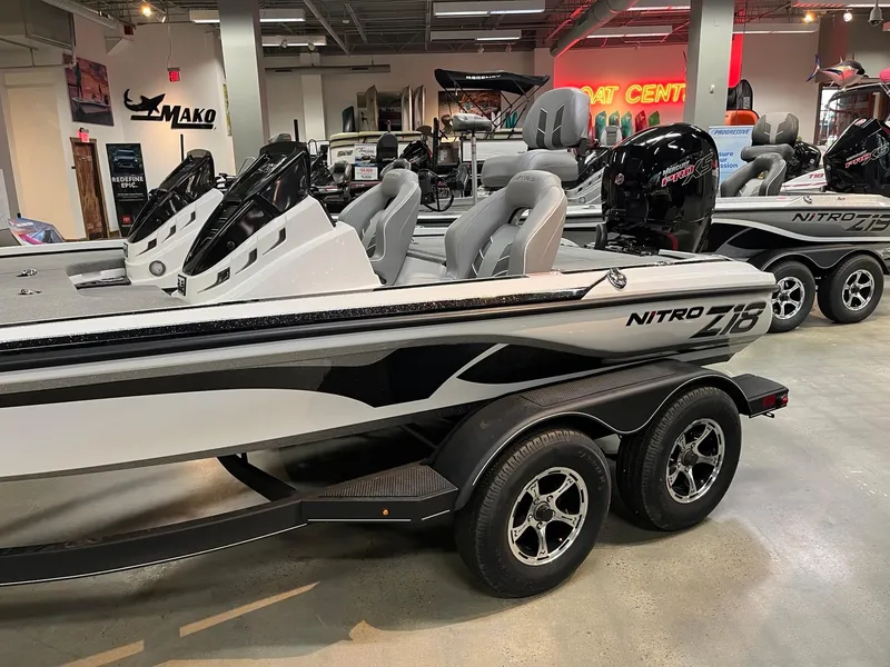 Slide: The Image of 2024 Nitro Z18 Pro boat in showroom, featuring sleek design and modern seating. - 3