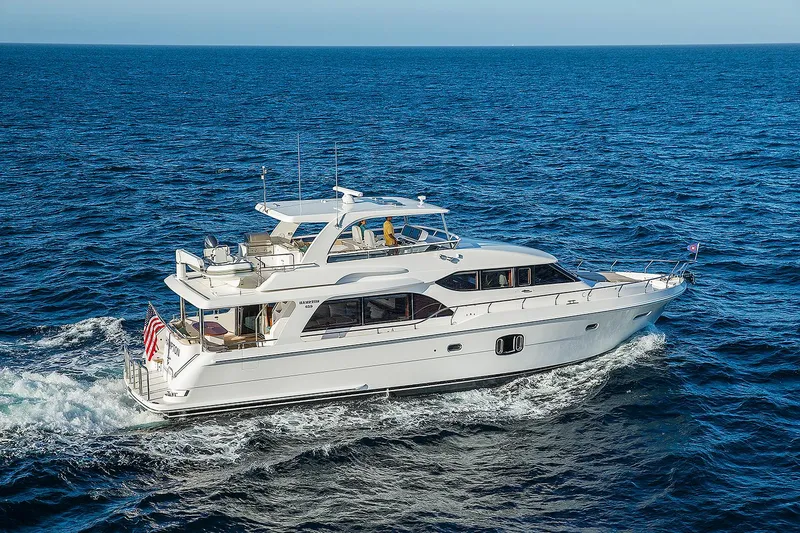 Slide: The Image of 2026 Hampton 650 Pilothouse yacht cruising on open sea. - 0