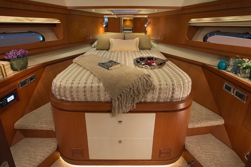 Slide: The Image of Luxurious 2026 Hampton 650 Pilothouse cabin interior with cozy bed and elegant decor. - 12