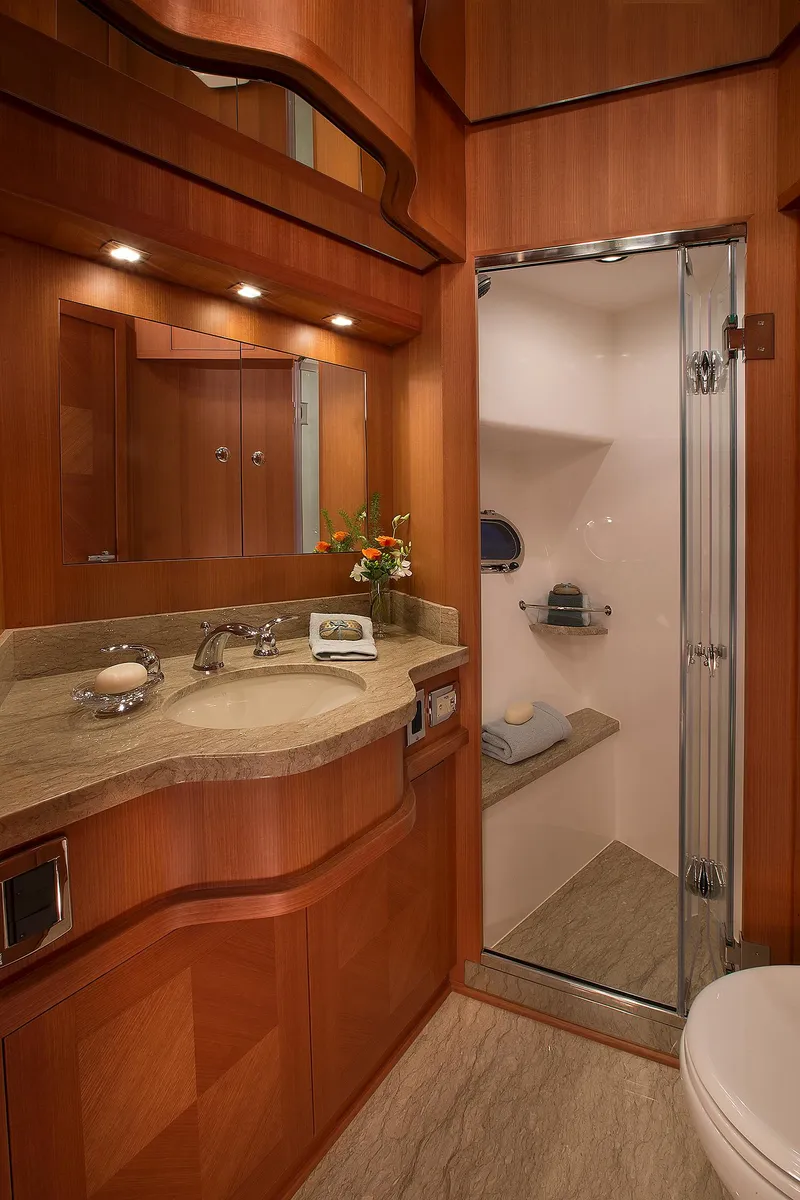 Slide: The Image of Luxurious bathroom in 2026 Hampton 650 Pilothouse yacht with elegant wood finishes. - 14