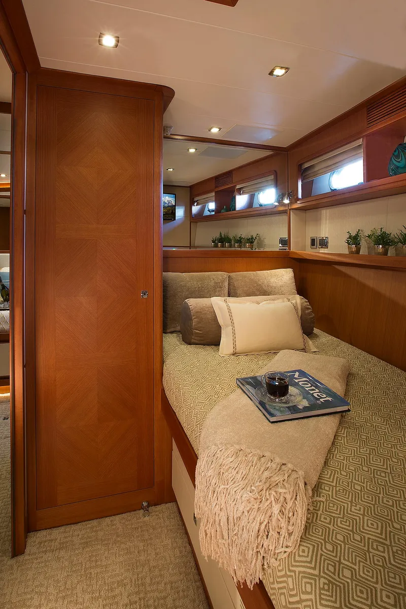 Slide: The Image of Luxurious interior of 2026 Hampton 650 Pilothouse yacht with cozy bedding and elegant decor. - 15
