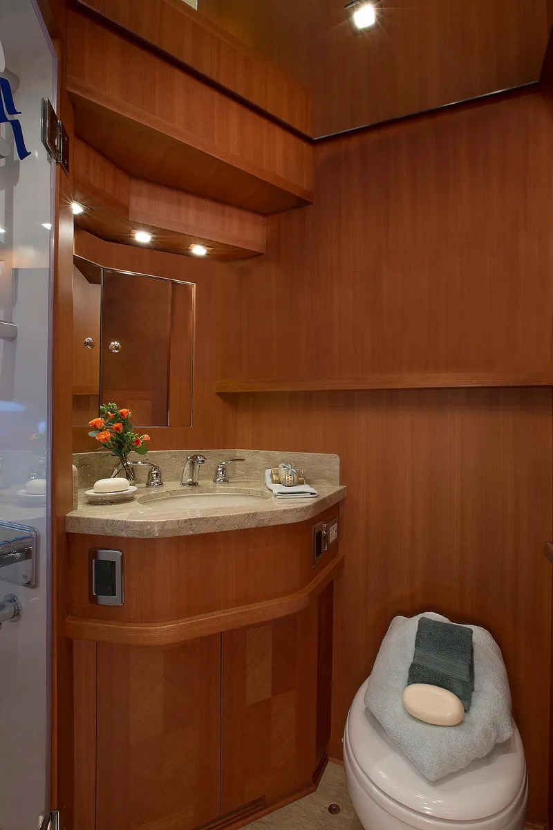 Slide: The Image of Luxurious bathroom in 2026 Hampton 650 Pilothouse yacht with wood finish and modern amenities. - 16