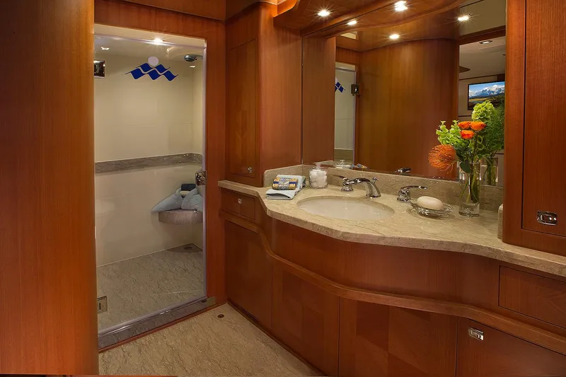 Slide: The Image of Luxurious bathroom in 2026 Hampton 650 Pilothouse yacht with elegant wood finishes and modern fixtures. - 19
