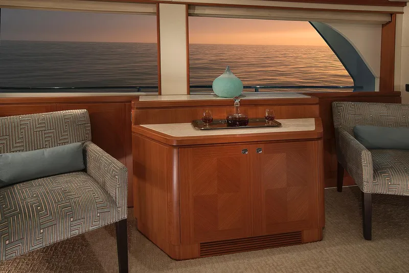 Slide: The Image of Luxurious interior of 2026 Hampton 650 Pilothouse yacht with ocean view at sunset. - 2