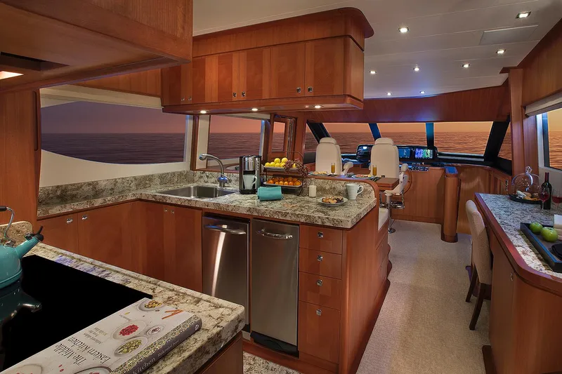 Slide: The Image of Luxurious interior of 2026 Hampton 650 Pilothouse yacht with modern kitchen and ocean view. - 4