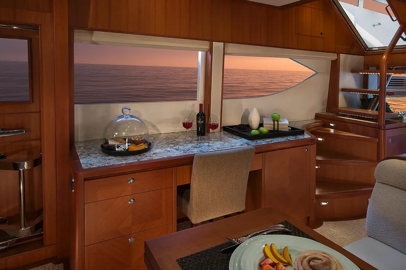 Slide: The Image of Luxurious interior of 2026 Hampton 650 Pilothouse yacht with elegant dining setup. - 5