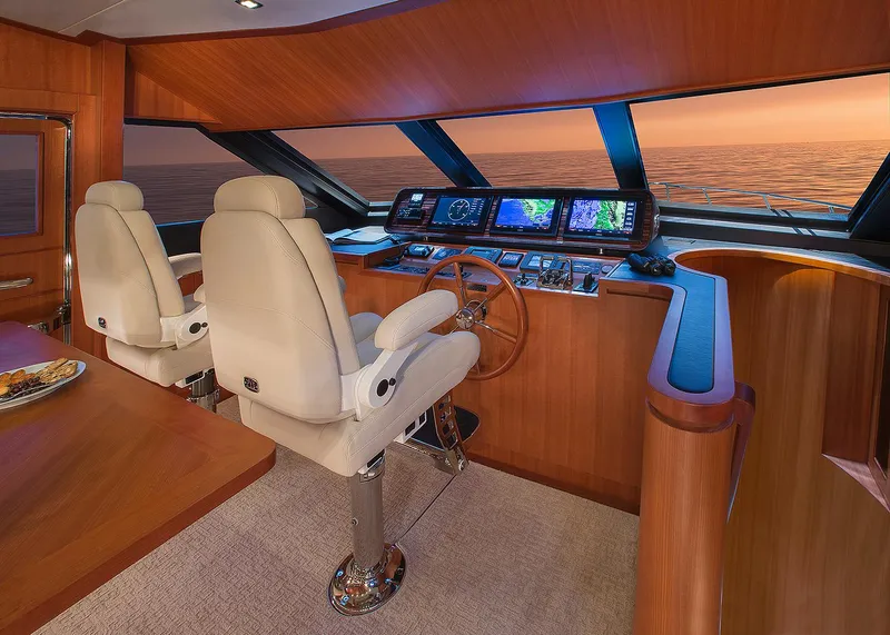 Slide: The Image of Luxurious 2026 Hampton 650 Pilothouse interior with modern navigation equipment and elegant seating. - 8