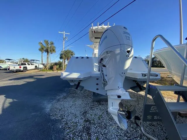 Slide: The Image of 2022 Everglades 235CC boat interior with open storage compartments. - 10