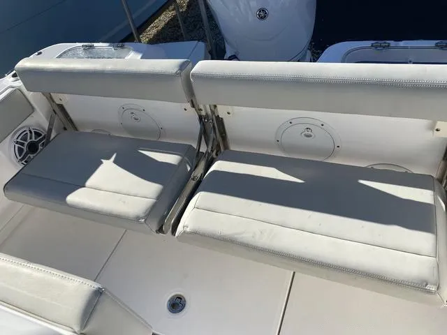 Slide: The Image of Open storage compartment on a 2022 Everglades 235CC boat. - 13