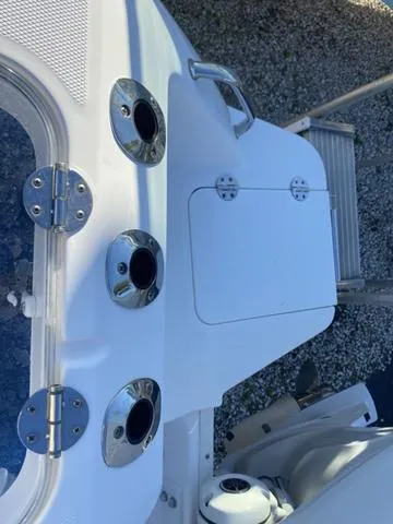 Slide: The Image of Fire extinguisher mounted on 2022 Everglades 235CC boat interior. - 16