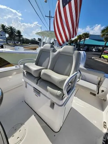 Slide: The Image of 2022 Everglades 235CC boat dashboard with steering wheel and electronic controls. - 18