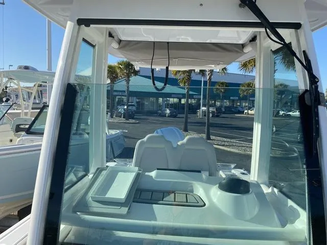 Slide: The Image of Control panel of 2022 Everglades 235CC boat with Garmin displays and Yamaha controls. - 20