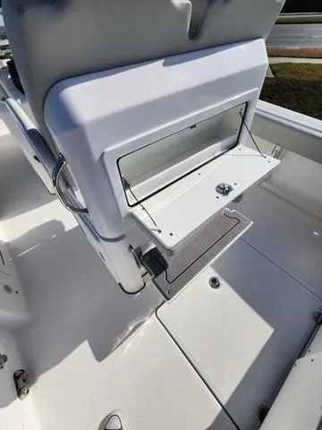 Slide: The Image of Steering wheel of a 2022 Everglades 235CC boat, featuring a sleek chrome design. - 21