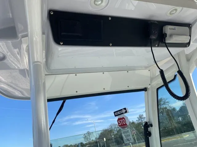 Slide: The Image of 2022 Everglades 235CC boat with dual gray seats and armrests. - 27