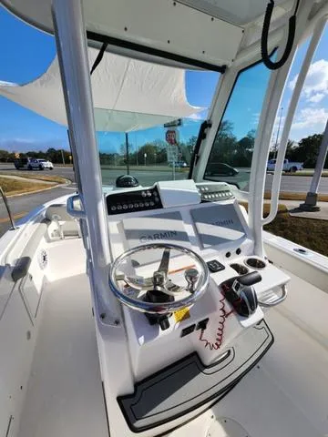 Slide: The Image of 2022 Everglades 235CC boat interior with dual seats and steering wheel. - 28