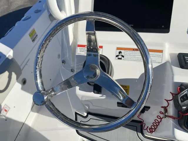 Slide: The Image of 2022 Everglades 235CC boat interior, featuring sleek white design and modern amenities. - 30