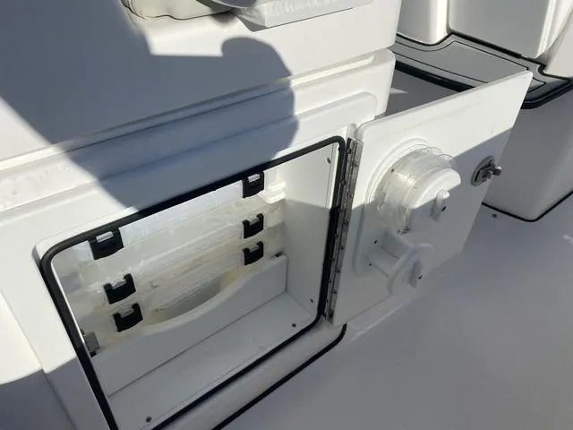 Slide: The Image of 2022 Everglades 235CC boat seats with white cushions and speaker system. - 33