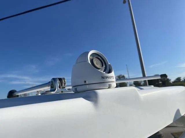 Slide: The Image of 2022 Everglades 235CC boat seat, white upholstery, sleek design, outdoor setting. - 34