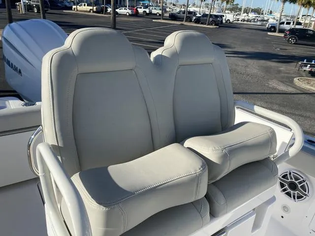 Slide: The Image of 2022 Everglades 235CC boat with open storage compartment and Yamaha engine detail. - 37