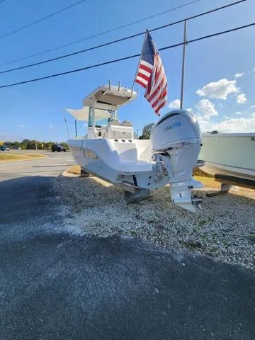 Slide: The Image of 2022 Everglades 235CC boat on trailer, side view, sunny day. - 4