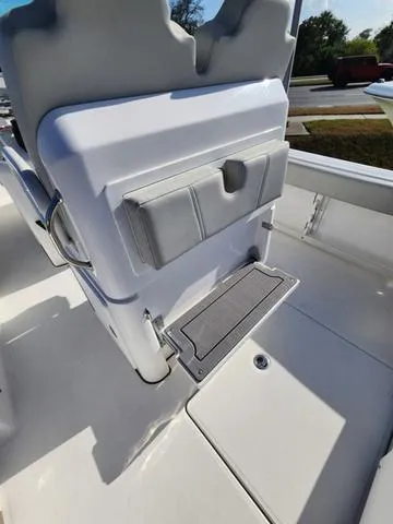 Slide: The Image of 2022 Everglades 235CC boat deck with storage compartment and seating area. - 40