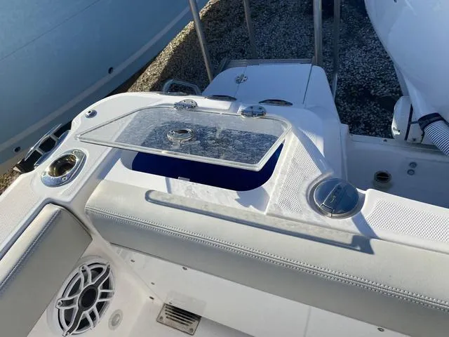 Slide: The Image of 2022 Everglades 235CC boat interior with seating and engine details. - 44