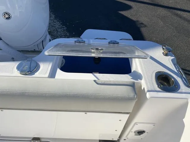 Slide: The Image of 2022 Everglades 235CC boat, featuring a sleek white hardtop and modern design elements. - 45