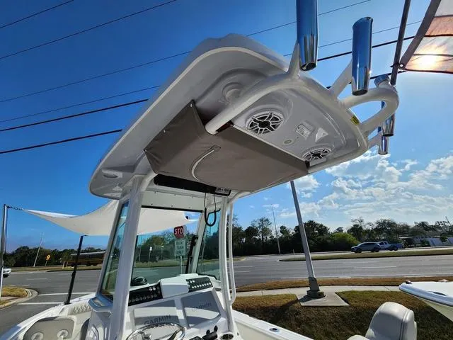 Slide: The Image of 2022 Everglades 235CC boat interior with speakers and storage compartment. - 47