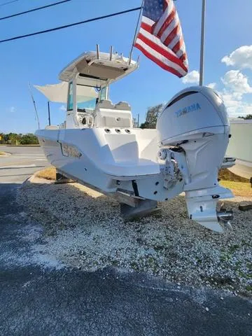 Slide: The Image of 2022 Everglades 235CC boat on trailer, side view, sunny day. - 6