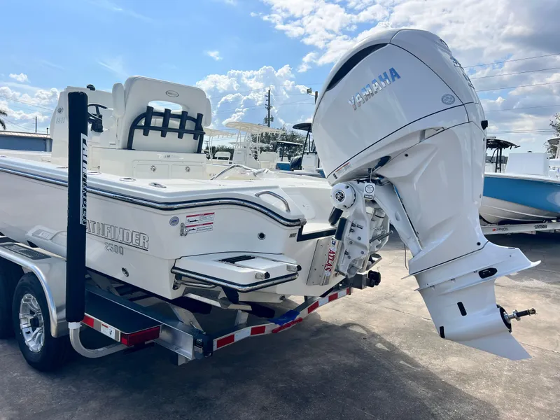 Slide: The Image of 2025 Pathfinder 2500 Hybrid boat with Yamaha outboard engine on a trailer. - 10