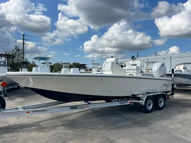 Slide: The Image of 2025 Pathfinder 2500 Hybrid boat on trailer under cloudy sky. - 11