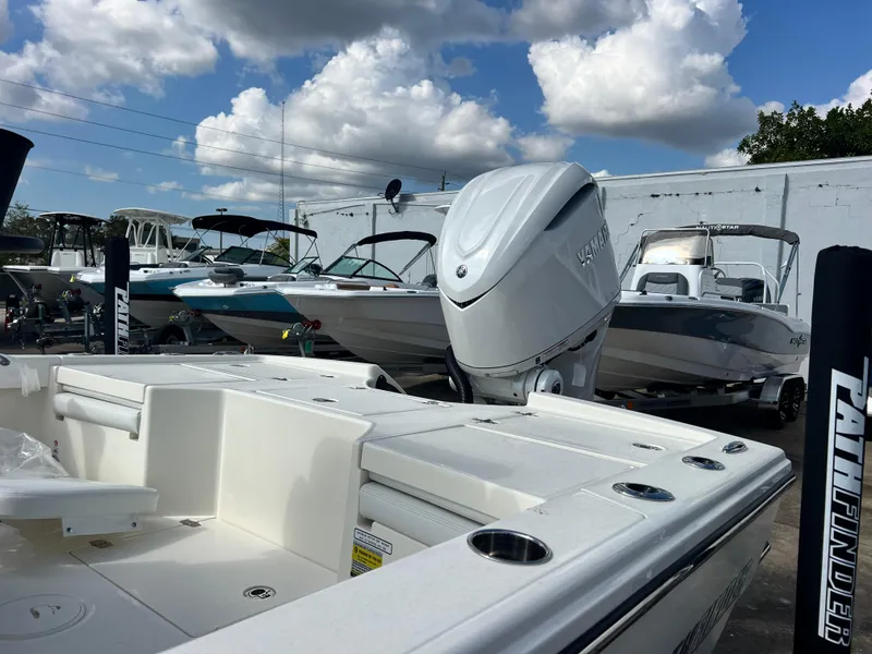 Slide: The Image of 2025 Pathfinder 2500 Hybrid boat with Yamaha engine, docked under a cloudy sky. - 8