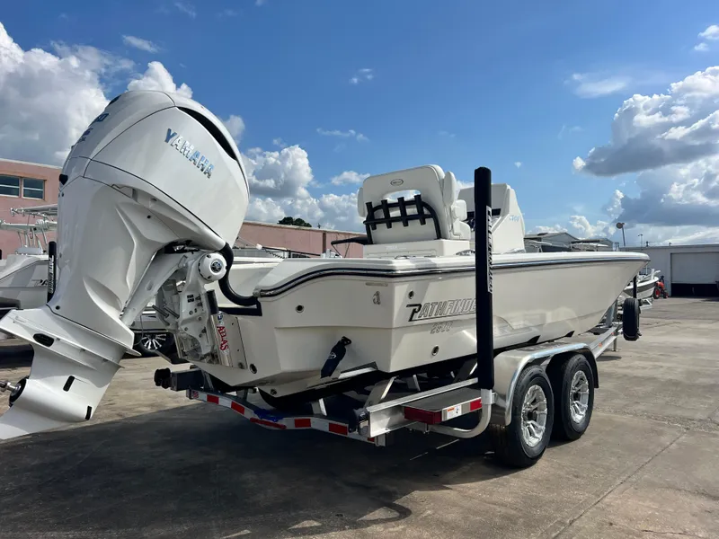 Slide: The Image of 2025 Pathfinder 2500 Hybrid boat on trailer, featuring Yamaha outboard motor, parked outdoors. - 9